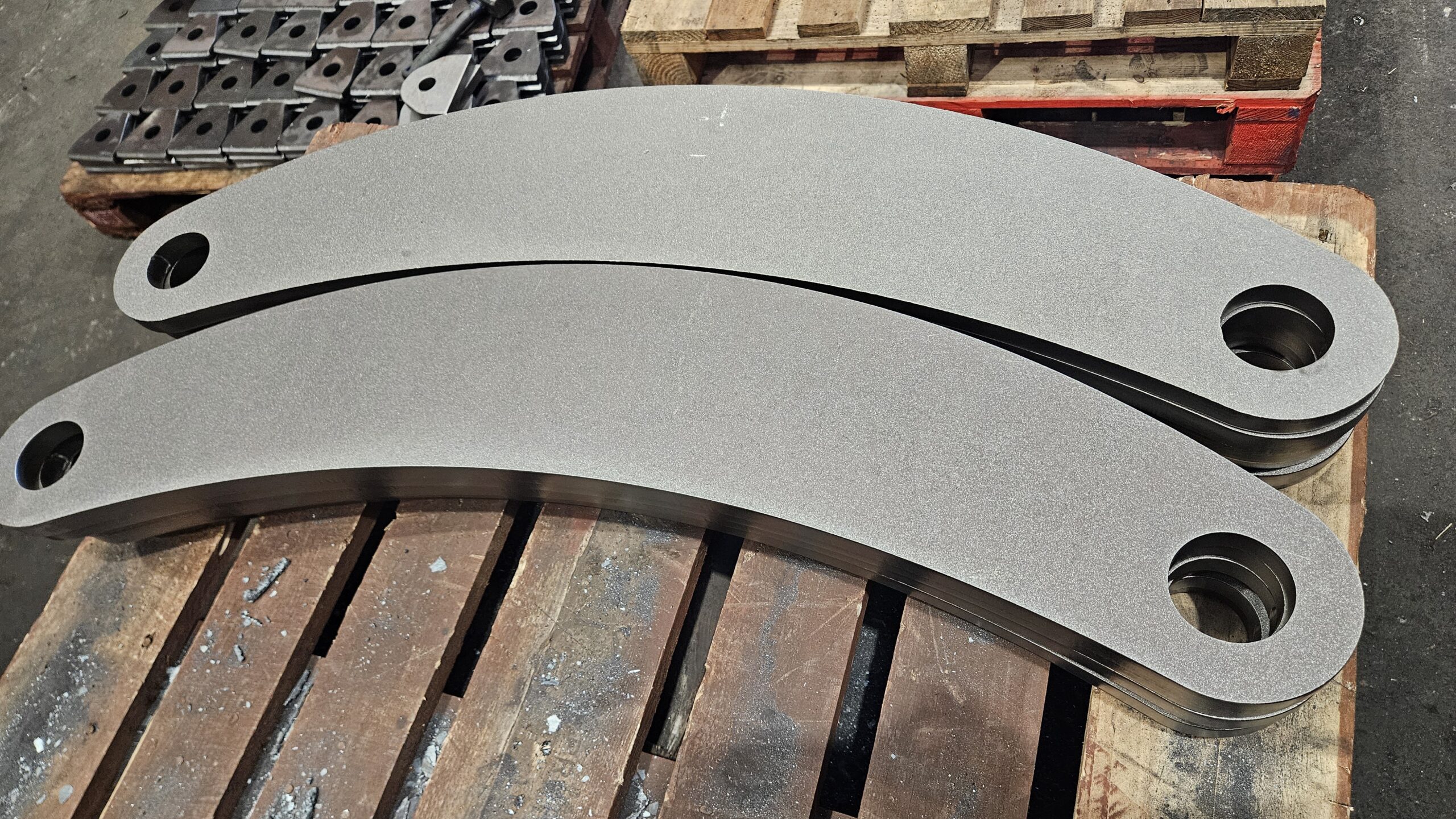 Shotblasted steel part in a shape of a banana.